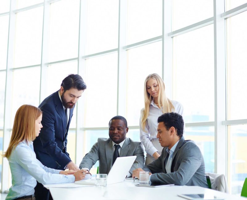 businesspeople-working-as-team-with-laptop