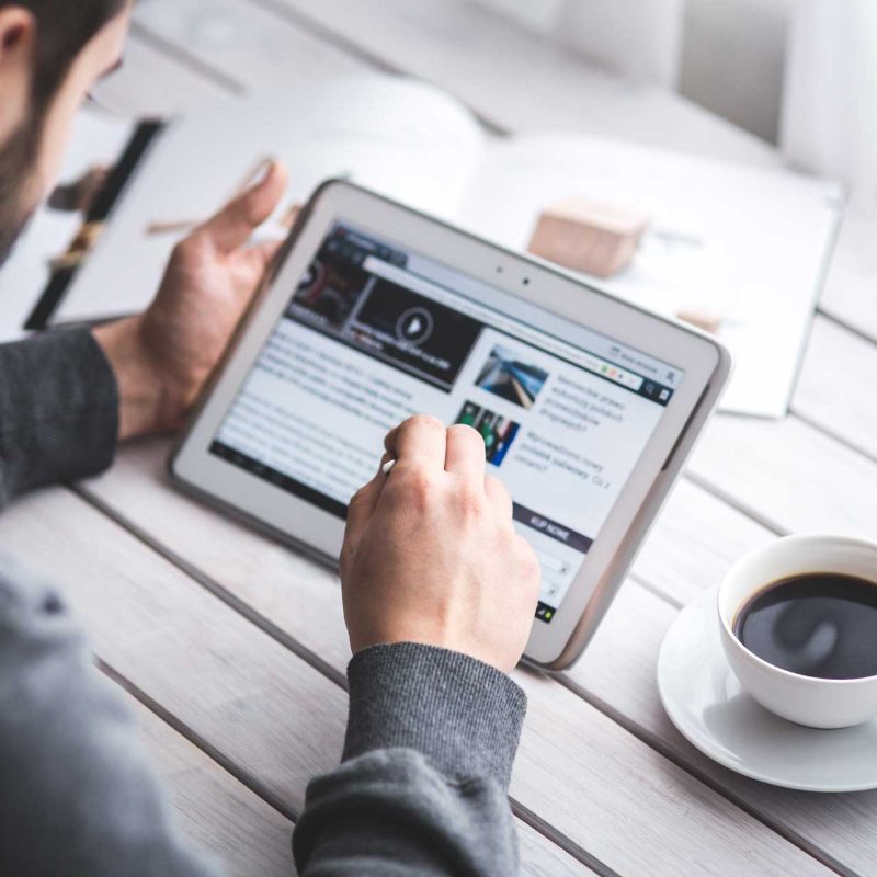 worker-reading-news-with-tablet(1)